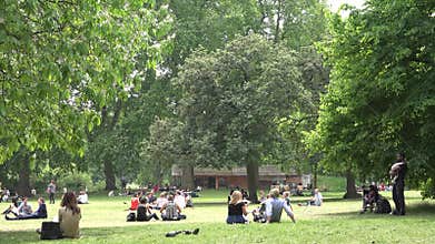 London James`s Park, People Tourists Relaxing Resting on Grass at Picnic
