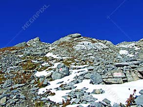 Alpine peak Falknis in the Ratikon border mountain massif or Raetikon Grenzmassiv and over the river Rhine valley Rheintal