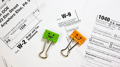 Binder Clips with Pen on W-9, W-2 and 1040 Tax Form