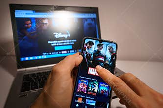 Tarragona, Spain. January 2020: Man holds a smartphone with the new Disney plus on screen