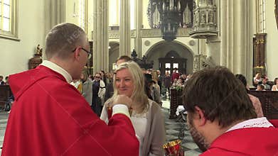 Brno, Czech Republic, September 24 , 2019: Catholic christian priest hands out sacramental bread altar communion wafers