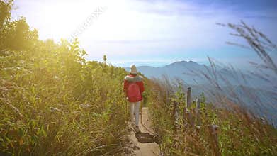 Young people walking on a hilltop in Doi Inthanon, Chiang Mai, Thailand
