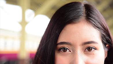 Young beautiful asian look at camera close up on eyes thai backpacker travel in bangkok thailand enjoyweekend