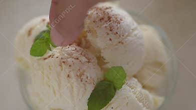 Ice_cream_mint_strawberry. Decoration of vanilla ice cream from mint leaves and ripe strawberries