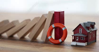 Domino effect of falling wooden block lifebuoy and residential building