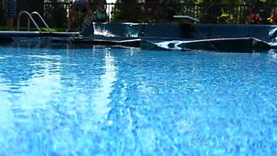Low angle view of pulling back a pool cover on a nice day