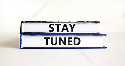 Stay tuned symbol. Concept words Stay tuned on beautiful books on a beautiful white table white background. Business, support,