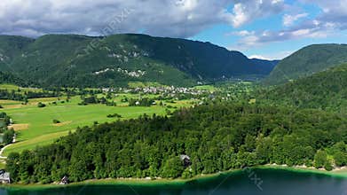Aerial view of Bohinj lake in Julian Alps. Popular touristic destination in Slovenia. Bohinj Lake, Church of St John the Baptist.