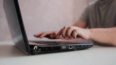 Broken laptop case and hinge. Defect and breakage of the laptop after a fall, close-up