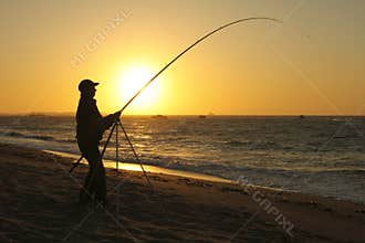Fisherman on beach