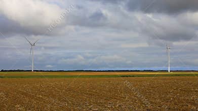 Wind turbines in a field during autumn
