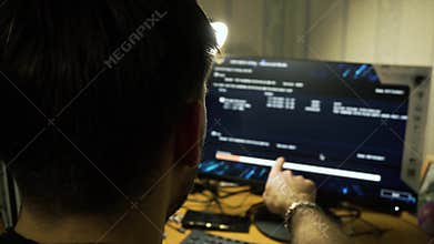guy points errors, calculations, reports while loading program computer screen.