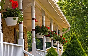 Geranium pots hanging on porch