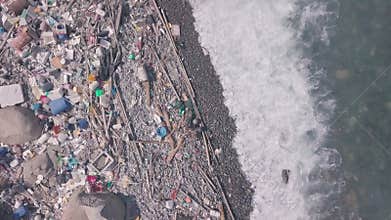 Climate change is impacted by beach covered in plastic and rubbish in Hong Kong. Aerial dr