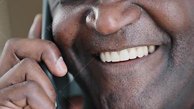 Half male face close up lips toothy white smile with healthy teeth happy smiling man talking phone answer call has