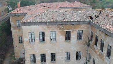 Abandoned asylum, aerial view of damaged facility
