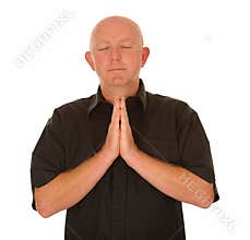 Bald man praying