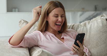 Excited happy smartphone user woman receiving good news