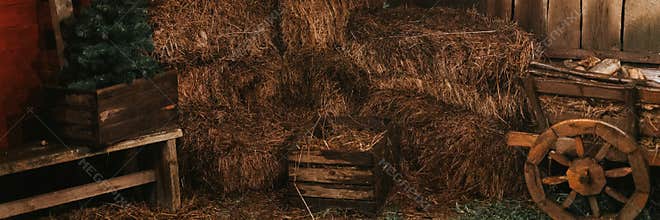 sheaves of hay in a wooden barn. harvesting food dry straw for feeding livestock. rustic country retro scene