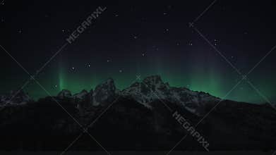 Northern Lights above mountain peaks