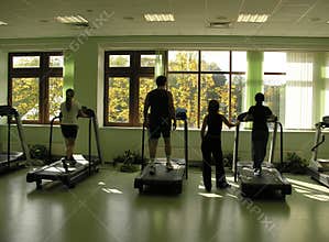 People with teacher in health club