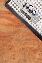 Electrical circuit on breadboard on dirty wood
