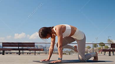 Caucasian beautiful woman doing yoga in the park. Be H3althy