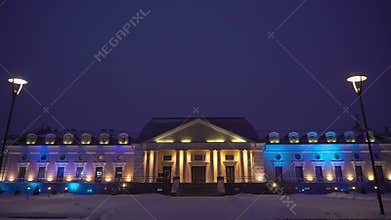 Old historical European building. Facade is yellow with white columns, exterior.