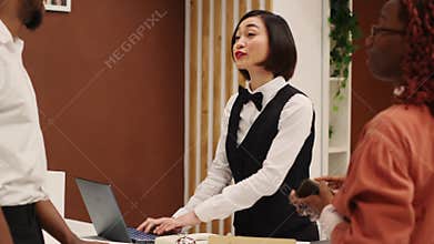 Receptionist imputing guests info