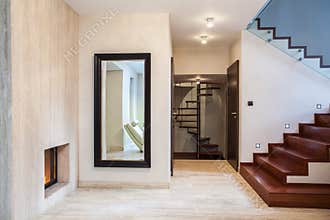 Travertine house: mirror and stairs