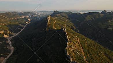 aerial scenic landscape with green fields, meadows, curved mountain river and mountain ridge with high mountains and