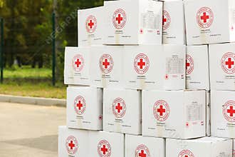 Boxes with humanitarian aid with the logo of the humanitarian organization \"Ukrainian Red Cross Society\"