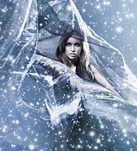 A woman in a dress on a blowing silk background