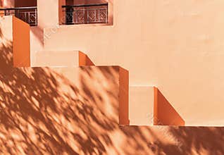 Capturing the Timeless Charm of an Egyptian Hotel\'s Terracotta Interior, Palm Trees, Arches, and Sunlit