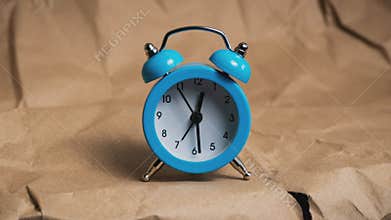 Hands of the Classic Alarm Clock Count the Time