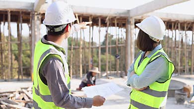 Female and male civil engineers Discuss details of construction site inspection project Structural Engineers and Collaboration