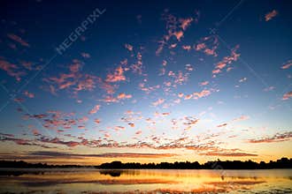 Gold dawn above lake