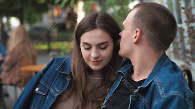 Couple Denim clothes On a date in a vintage restaurant outside They are talking Basking Hugging