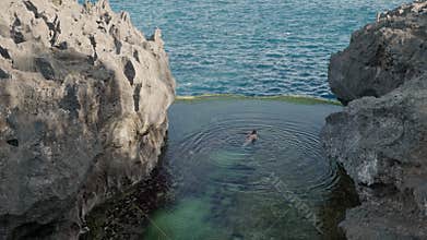 4K video of tourist swimming at Angel's Billabong,Nusa penida , Bali, indonesia.