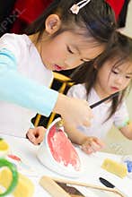 Child Painting Pottery