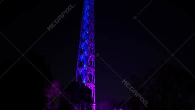 Night scenes - Tower illuminated with multicolored neon