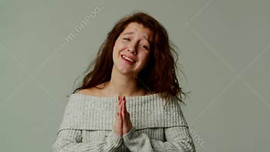 A pretty teenage girl asks her parents for money to buy fashionable clothes or jewelry. A young lady sincerely and