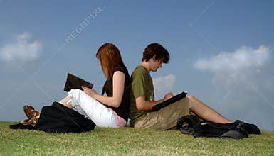 Teens studying outdoors