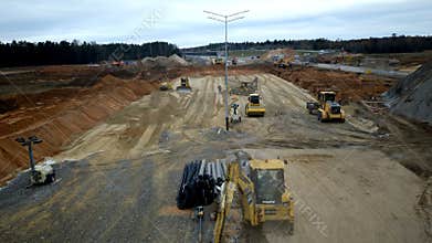 Timelapse of wide contemporary highway building across field