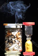 Cigarettes and hour glass