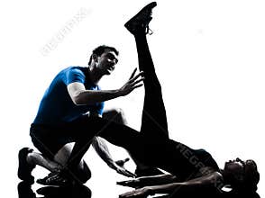 Aerobics instructor with mature woman exercising