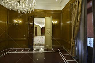 Empty office in a mansion with red marble floors and white borders,