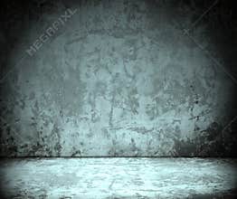 Room with grunge concrete wall, cement floor