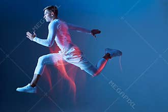 Sport commercial, poster, advertisement. Athlete in white sportswear on blue background jumps.