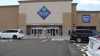 Sams Club retail store exterior Crowd of People wearing face masks during the pandemic